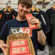 Man Holding Black Country Chocolate